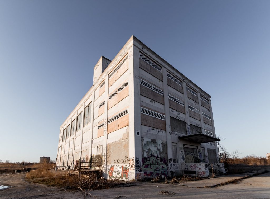 facade of old abandoned building under sky